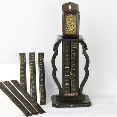Small Stationary Pillar Clock with Balance Wheel and Replaceable and Segmented Dial Panel